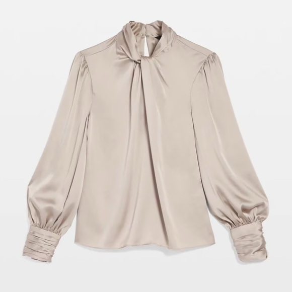 This satin blouse has a twisted neckline keyholes and blouson sleeves for flair - Picture 1 of 7